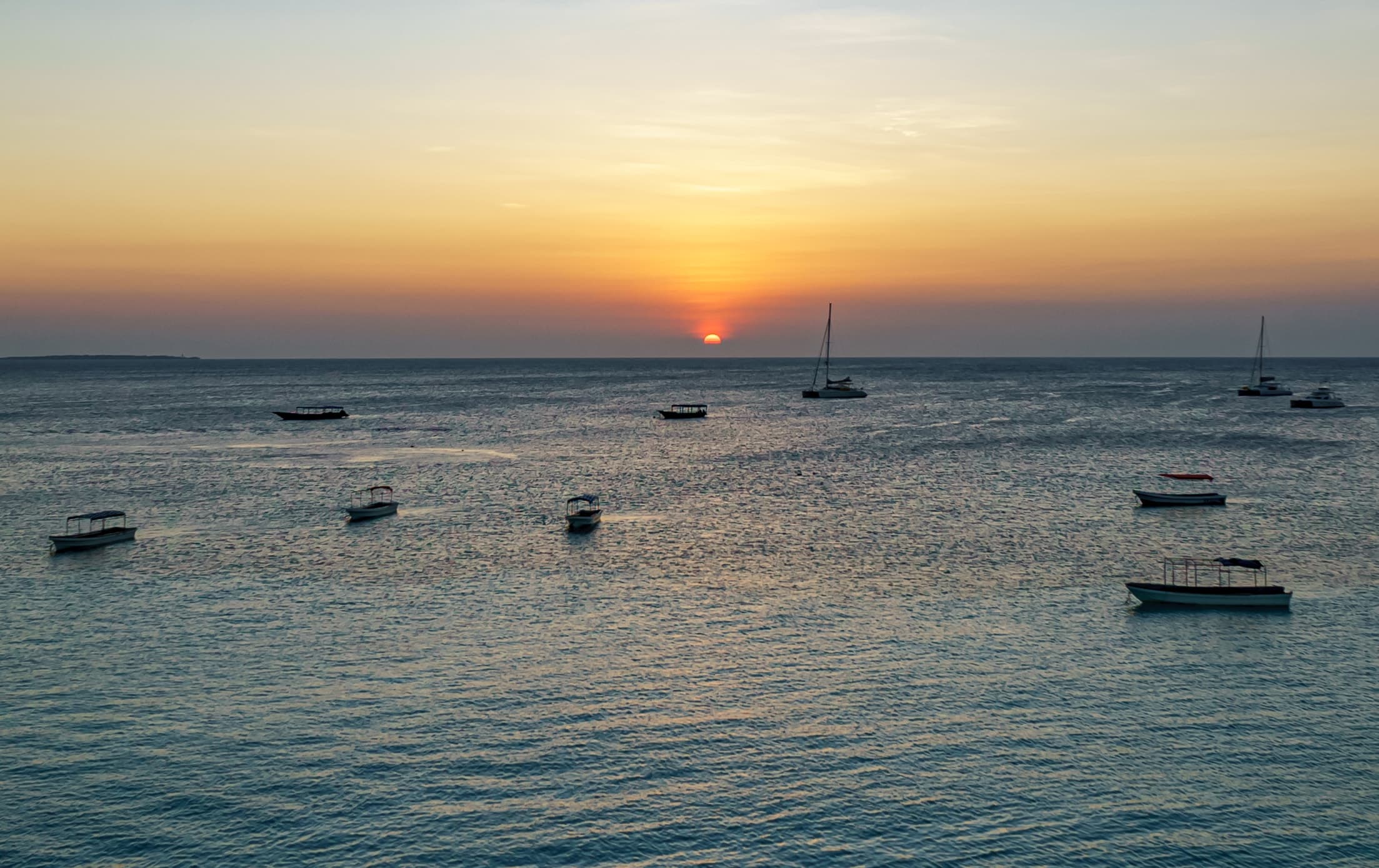 Boats at anchor off Nungwi, Zanzibar, at sunset