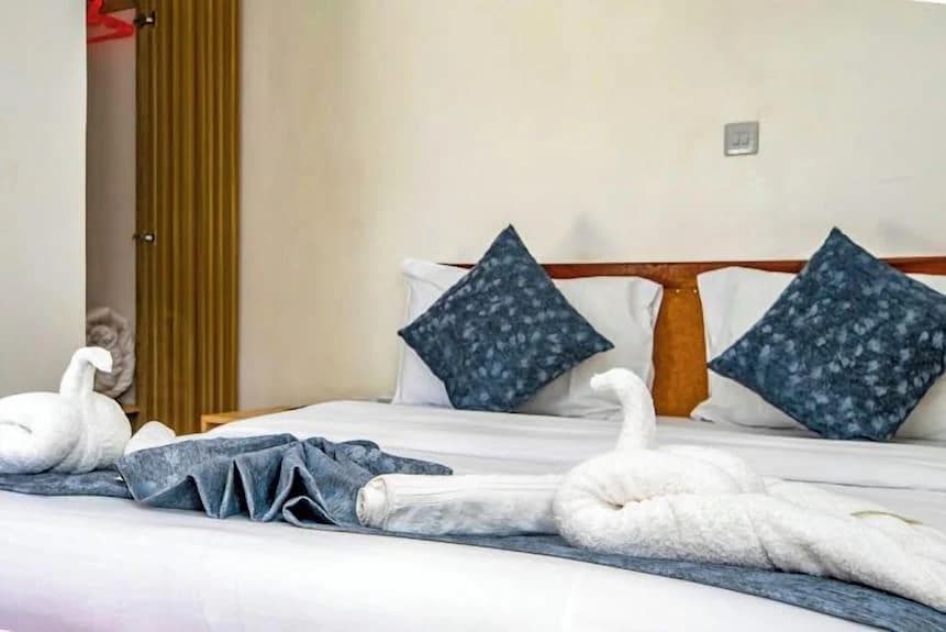Double bed in a guest room at Leisure Apex Resort