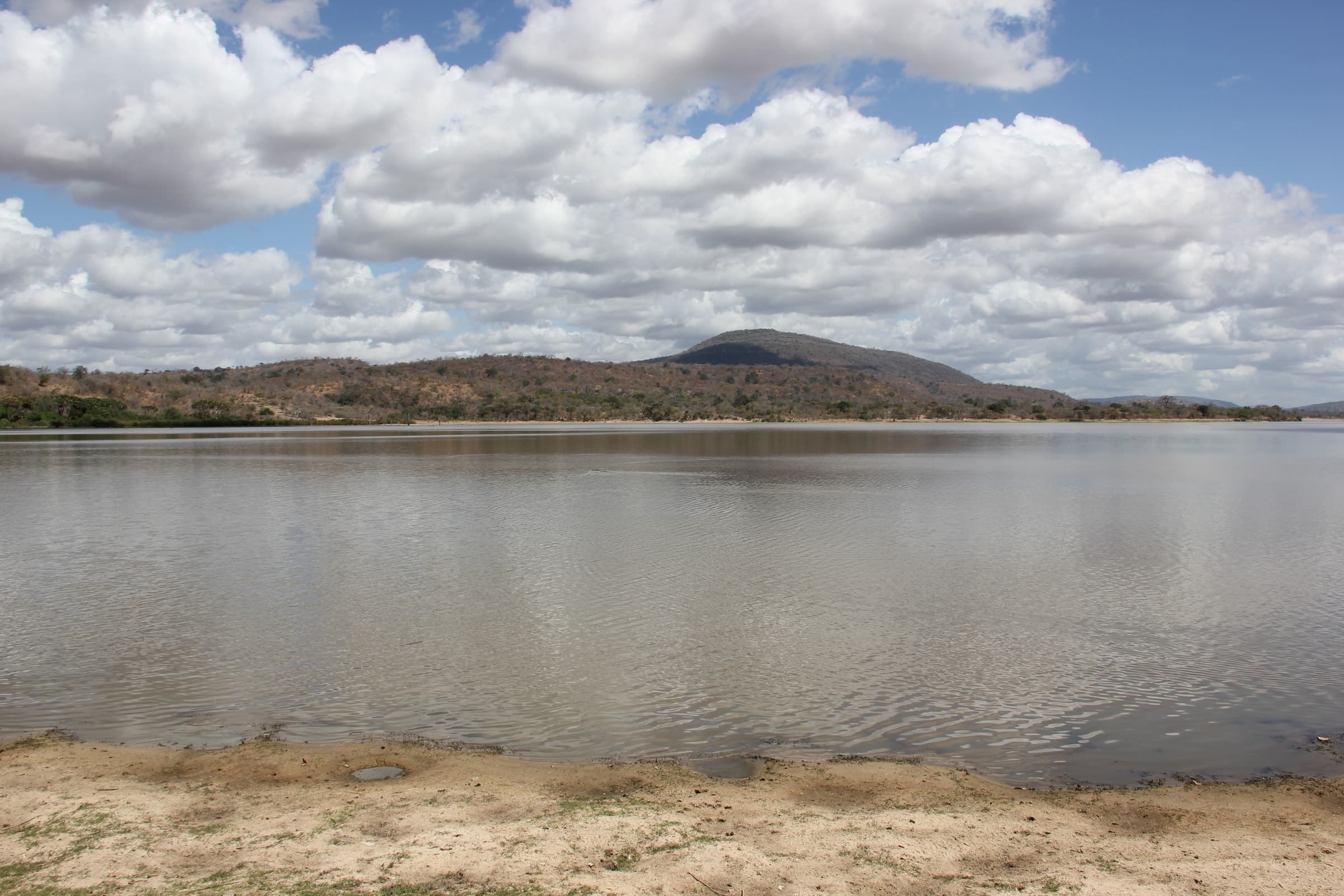 A wide river and low hills in the Selous Game Reserve, Tanzania